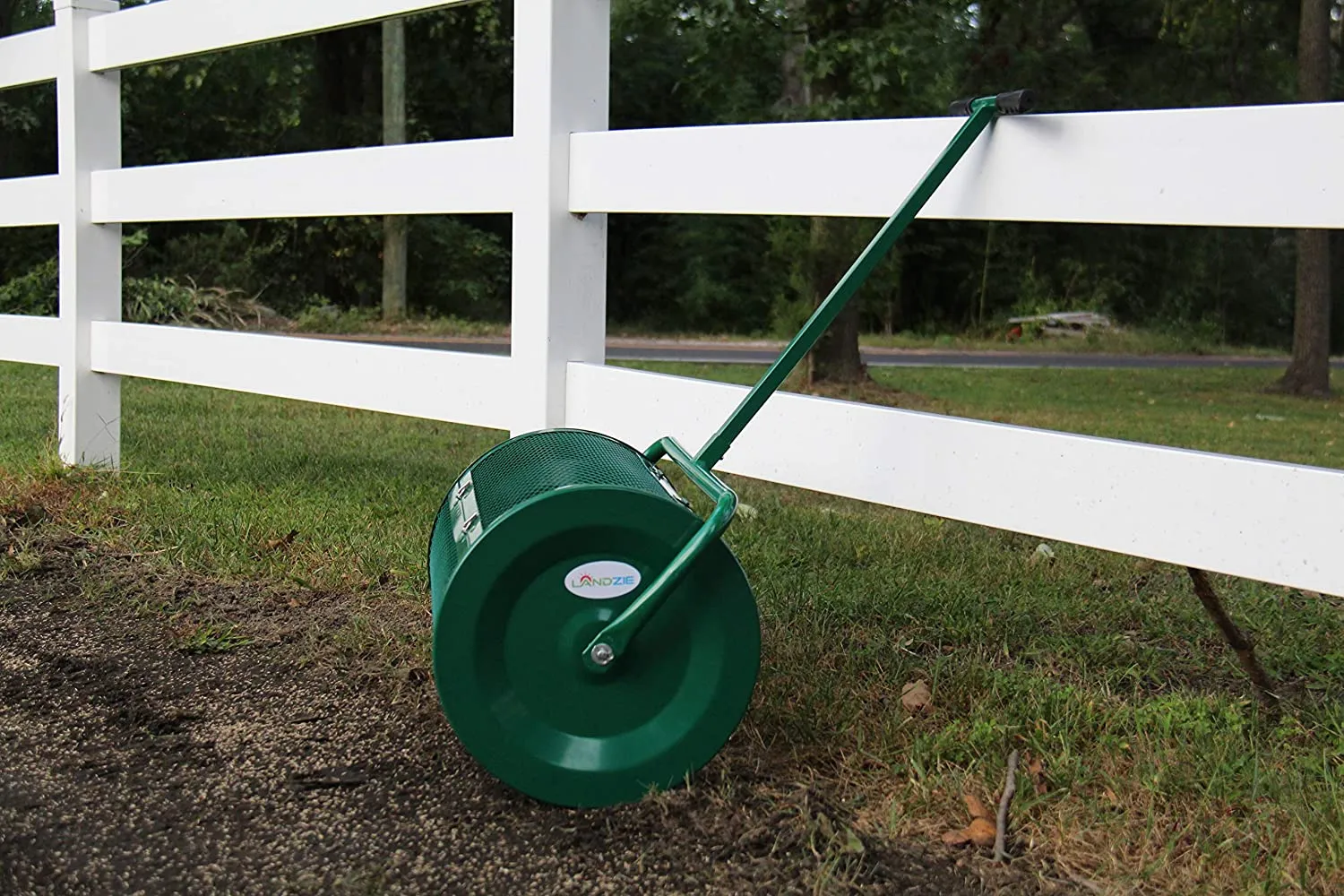 Landzie Peat Moss Spreader leaning on a fence